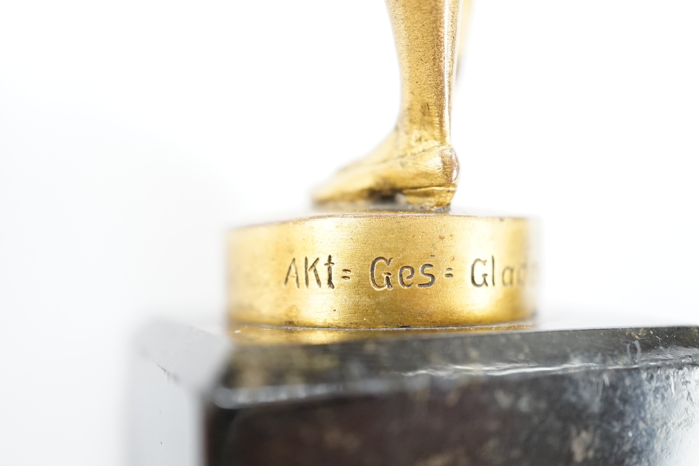 An ormolu bronze of a violinist on a marble base, signed Aktien-Gesellschaft Gladenbeck, Berlin, 14cm high